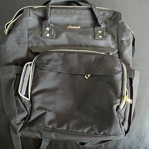 Large, black, multi pocketed backpack
